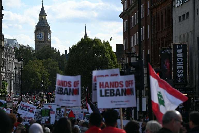 pales2-1728138831 Pro-Palestinian activists and supporters wave flags and hold placards as they pass through central London, during a March for Palestine on October 5, 2024. - A Hamas attack on October 7, 2023 resulted in the death of 1,205 people on Israeli side, most of them civilians, according to an AFP tally based on official Israeli figures, which includes hostages killed in captivity. Out of 251 people taken hostage that day, 97 are still being held inside the Gaza Strip, including 33 who the Israeli military says are dead. Israel's retaliatory offensive in Gaza has killed at least 41,788 people, the majority of them civilians, according to figures provided by the Hamas-run territory's health ministry. The United Nations has described the figures as reliable. (Photo by JUSTIN TALLIS / AFP)