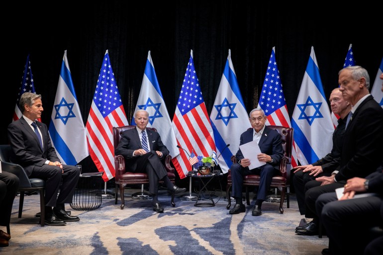 U.S. President Joe Biden, center left, pauses during a meeting with Israeli Prime Minister Benjamin Netanyahu, center right, in Tel Aviv, Israel, Wednesday, Oct. 18, 2023. At left: U.S. Secretary of State Antony Blinken; at right: Minister of Defense Yoav Gallant, second right and lawmaker Benny Gantz, right. (Miriam Alster/Pool Photo via AP)
