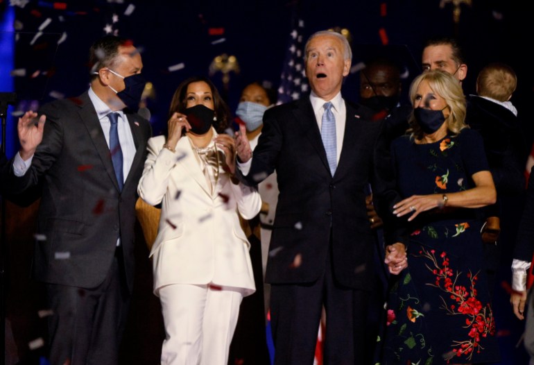 rtx880tv-1 Democratic 2020 U.S. presidential nominee Biden vice presidential nominee Harris react to the confetti at their election rally in Wilmington