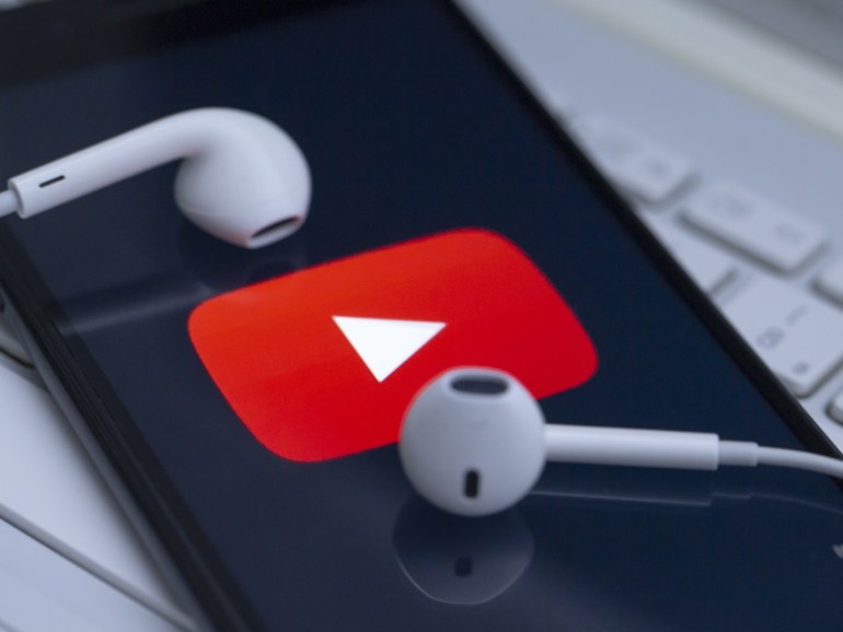 230283a3-8189-4584-93ca-c4077d738fda Mobile applications- - ANKARA, TURKEY - NOVEMBER 26: YouTube logo is being displayed in a smart phone and an earphone is seen in Ankara, Turkey on November 26, 2019.