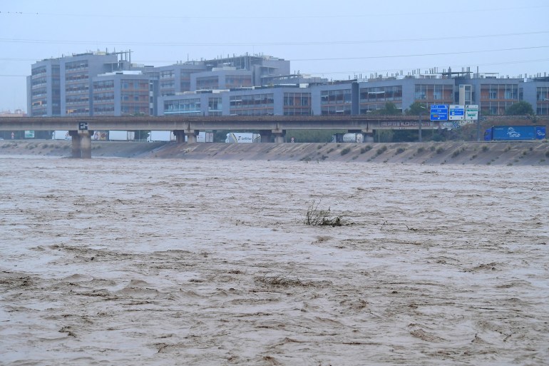 89-13-1730373007 A picture taken on October 30, 2024 shows the Turia river following floods in Valencia, eastern Spain. - Floods triggered by torrential rains in Spain's eastern Valencia region has left 51 people dead, rescue services said on October 30. (Photo by Jose Jordan / AFP)