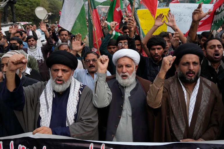 Shiite Muslims chant slogans to condemn the killing of Shiite Muslims by gunmen in an ambush in Kurram district, during a demonstration in Lahore, Pakistan, Friday, Nov. 22, 2024. (AP Photo/K.M. Chaudary)