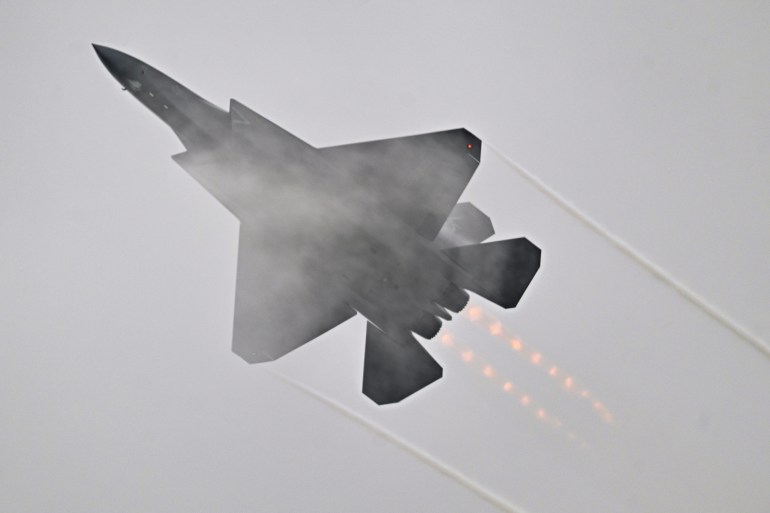 Chinese-made Shenyang J-35A fighter jet flies during the 15th China International Aviation and Aerospace Exhibition in Zhuhai, in south China's Guangdong province on November 15, 2024. (Photo by Hector RETAMAL / AFP)