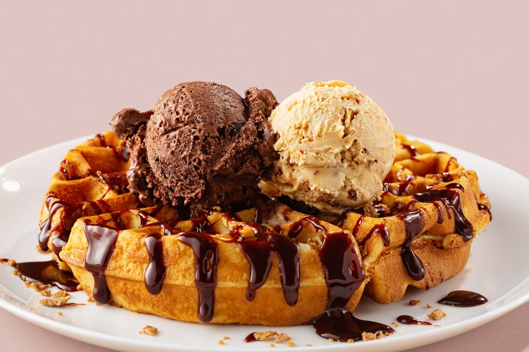 gettyimages-1485085231-1731342694 Close-up of waffle with ice cream gelato scoop on plate