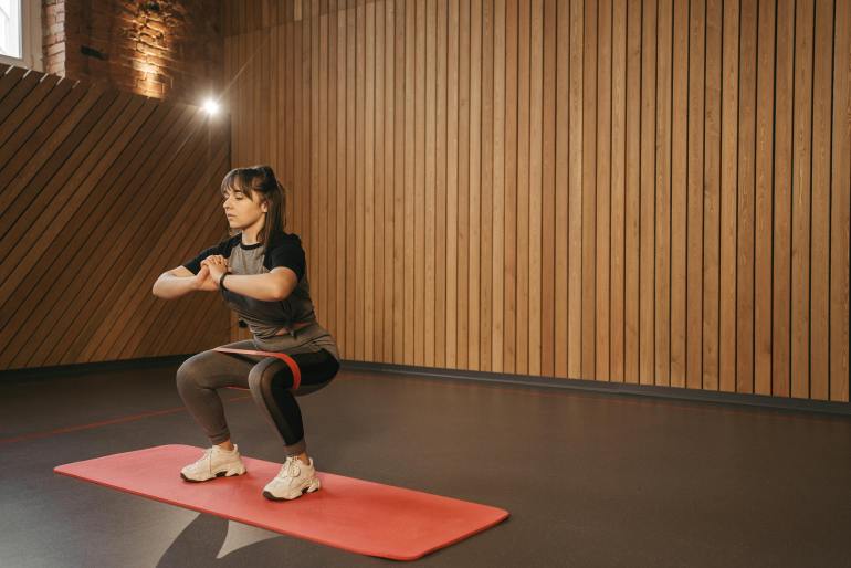 pe6339655-1732205473 A Woman Doing the Squats with a Resistance Band بيكسلز