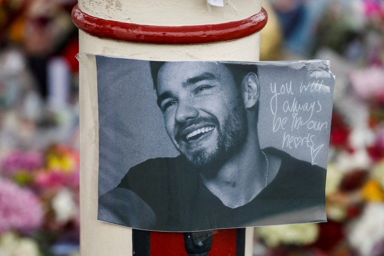 reuters-1731330874 Flowers and tributes are placed at the bandstand in West Park to remember former One Direction singer Liam Payne, in Wolverhampton, Britain November 8, 2024. REUTERS/Temilade Adelaja