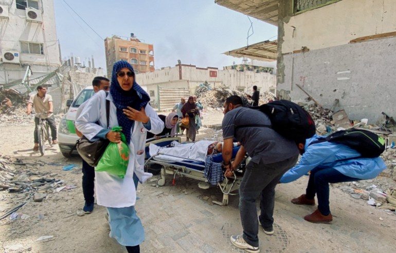147-6-1733295140 Palestinians evacuate Kamal Adwan hospital following an Israeli strike, amid the ongoing conflict between Israel and the Palestinian Islamist group Hamas, in Beit Lahia in the northern Gaza Strip, May 21, 2024. REUTERS/Osama Abu Rabee TPX IMAGES OF THE DAY