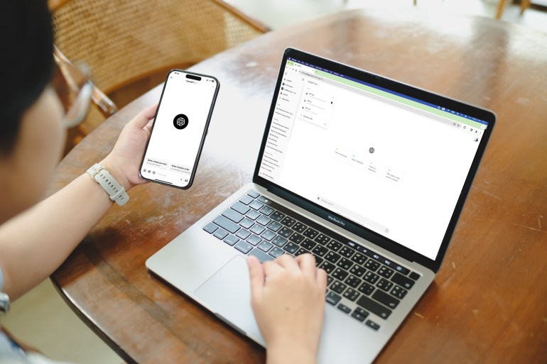 2543566641-1733131109 Bangkok. Thailand. November 11,2024 ; A woman using Chat GPT-4o, online bot service, chatbot on laptop and phone screen.