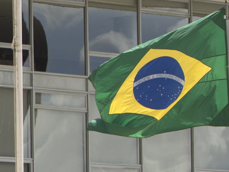 64ace9e9-f9b2-48ed-9623-bbdf2261415d epa05652187 The Brazil flag flies at half-mast, in the Palacio de Planalto in Brasilia, Brazil, on 29 November 2016. Temer delivered remarks on the plane carrying members of the Brazilian soccer team Chapecoense team which crashed on approach to Medellin, Colombia on 28 November. Temer expressed his solidarity with the team and the dozens of families affected by the tragedy, and promised the government would do everything within its reach to help relieve their pain. The president declared three days of national mourning. EPA/Joedson Alves