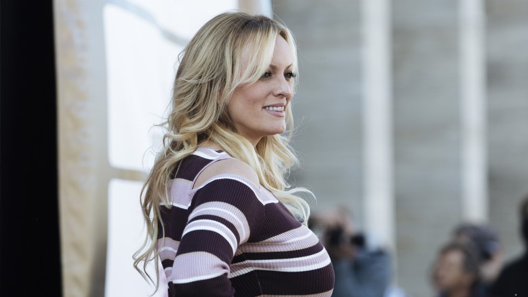 91c06134-f1d8-4016-b67b-800a9e9009f7 epa07085389 Former adult actress Stephanie Clifford, known as Stormy Daniels, poses during the opening of the Venus Erotic Trade Fair in Berlin, Germany, 11 October 2018. Daniels, who allegedly had a sexual encounter in 2006 with US President Donald J. Trump, sued the president over a hush money agreement she signed before he ascended to the Oval Office. Venus Berlin is among the largest international erotic trade fairs, with more than 250 exhibitions from 40 countries and 30,000 visitors. EPA-EFE/KAMIL ZIHNIOGLU