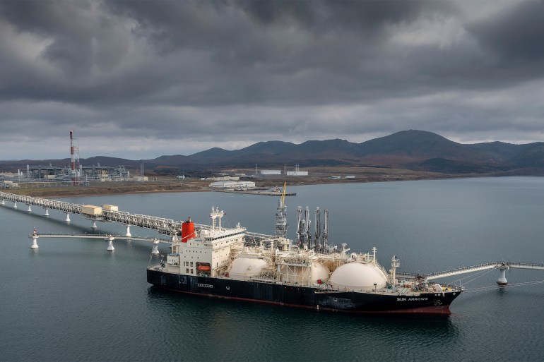 ap23070642909910-1695845553-1 FILE - The tanker Sun Arrows loads its cargo of liquefied natural gas from the Sakhalin-2 project in the port of Prigorodnoye, Russia, on Oct. 29, 2021. After a year of far-reaching sanctions aimed at degrading Moscow's war chest, economic life for ordinary Russians doesn't look all that different than it did before the invasion of Ukraine. But with restrictions finally tightening on the Kremlin's chief moneymaker — oil — the months ahead will be an even tougher test of President Vladimir Putin's fortress economy. (AP Photo, File)