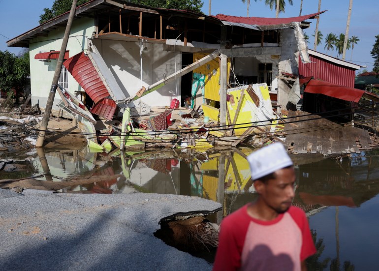 d-1-1733295239 A view of a house partially destroyed after floodwaters swept through at Tumpat, Malaysia, December 2, 2024. REUTERS/Hasnoor Hussain