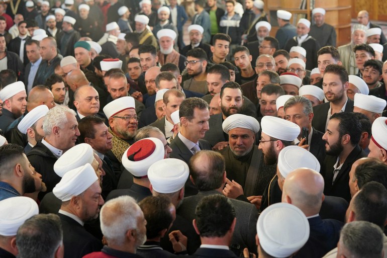 d8b1d988d8aad98ad8b1d8b2-d8b3d988d8b1d98ad8a71-1733697505 Syria's President Bashar al-Assad greets supporters during Eid al-Fitr prayers at a mosque in Damascus, Syria, in this handout released by SANA on April 10, 2024, Syria. SANA/Handout via REUTERS ATTENTION EDITORS - THIS IMAGE WAS PROVIDED BY A THIRD PARTY. REUTERS IS UNABLE TO INDEPENDENTLY VERIFY THIS IMAGE.