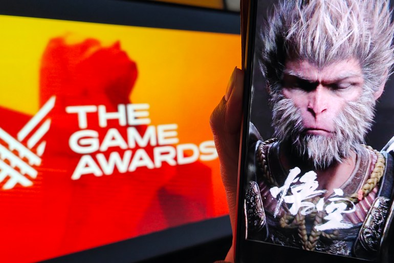 gettyimages-2189728955-1734181214 SHANGHAI, CHINA - DECEMBER 13: A smartphone screen shows the poster of "Black Myth: Wukong" against the logo of The Game Awards 2024 on December 13, 2024 in Shanghai, China. The "Black Myth: Wukong" wins the Best Action Game and Players' Voice awards at The Game Awards 2024 on December 13. (Photo by VCG/VCG via Getty Images)