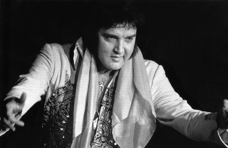 gettyimages-517213190-1733053811 (Original Caption) 8/16/1977-Lincoln, NB: Elvis Presley, 42, died 8/16 in Memphis, TN, of repiratory failure at Baptist Hospital. Presley, the gyrating, hip-swinging King of Rock and Roll is shown during 6/20 concert here.