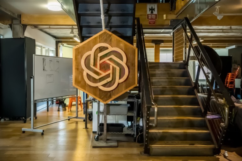 gv6tv-1728388807 OpenAI's logo hanging in its office الصحافة الأجنبية - technologyreview.com