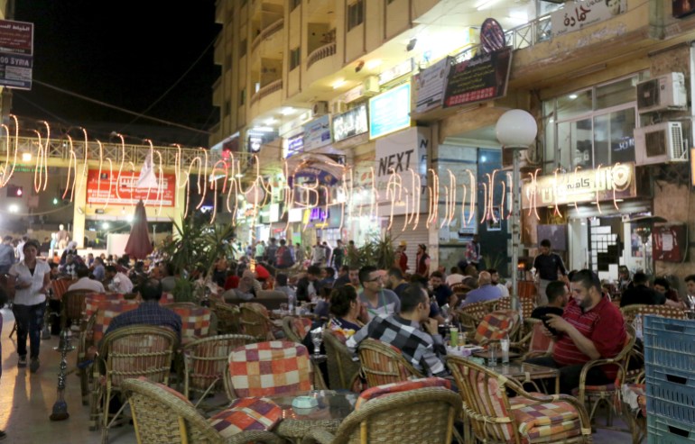 Syrians work at a coffee shop in an area called 6 October City in Giza, Egypt, March 19, 2016. Attracting visitors from across the country, a market mostly run by Syrians fleeing the war has recently gained popularity in Giza. The area, in 6 October City, is known as 'Little Damascus' due to its large Syrian population, as well as eateries and shops selling traditional Syrian delicacies. REUTERS/Mohamed Abd El Ghany