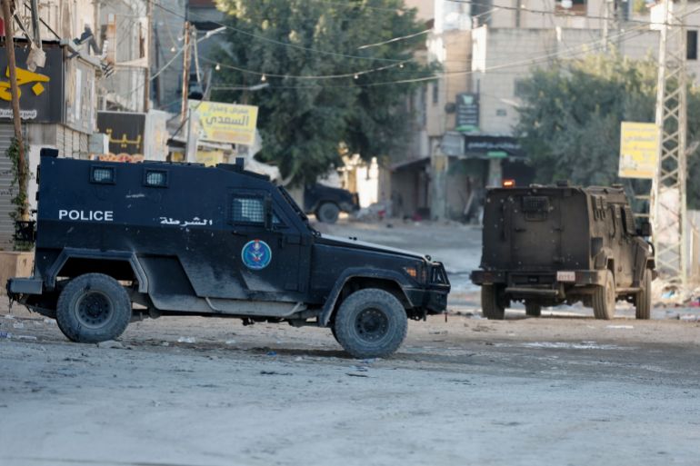 rc2prba0uc82-1734793443 Palestinian security forces patrol amid clashes with militants at the camp in Jenin, in the Israeli-occupied West Bank, December 18, 2024. REUTERS/Raneen Sawafta