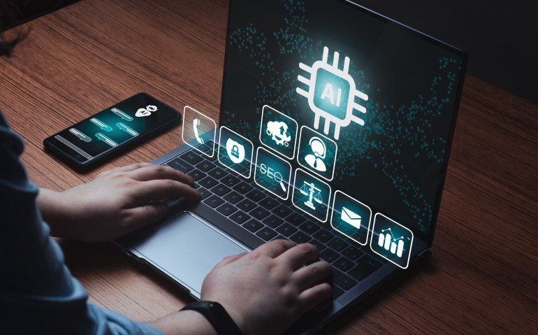 shutterstock_2342748377-1707902800 Woman use the power of AI on laptop and smartphone. Chat concept AI. Artificial Intelligence. Futuristic technology transformation. Write a prompt to generate images.