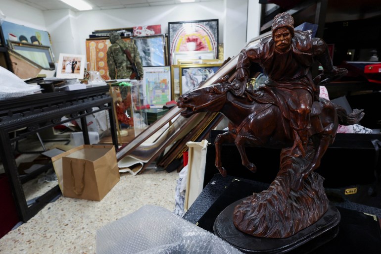 A view of personal souvenirs for Syria's Bashar al-Assad at one of the rooms at Presidential Palace known as Qasr al-Shaab "People's Palace", after rebels seized the capital and ousted Syria's Bashar al-Assad, in Damascus, Syria December 10, 2024. REUTERS/Amr Abdallah Dalsh