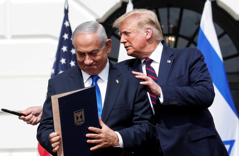 trump-neta-1735388248-1 Israel's Prime Minister Benjamin Netanyahu stands with U.S. President Donald Trump after signing the Abraham Accords, normalizing relations between Israel and some of its Middle East neighbors, in a strategic realignment of Middle Eastern countries against Iran, on the South Lawn of the White House in Washington, U.S., September 15, 2020. REUTERS/Tom Brenner TPX IMAGES OF THE DAY