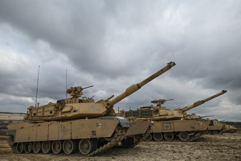 Abrams Tank Training in Poland's Nowa Deba- - NOWA DEBA, POLAND - APRIL 12: American soldiers of the 2nd Battalion, 70th Armor Regiment, 2nd Armored Brigade Comat Team, 1st Infantry Division supporting the 4th Infantry Division, are seen during a high-intensity training session utilizing M1A2 Abrams tanks at Nowa Dęba training ground in Nowa Deba, Poland on April 12, 2023. US and Polish soldiers train together at Nowa Dęba to strengthen NATO's eastern flank. The recent acquisition of 250 M1A2 Abrams tanks by Poland from the US Army furthers this collaboration.