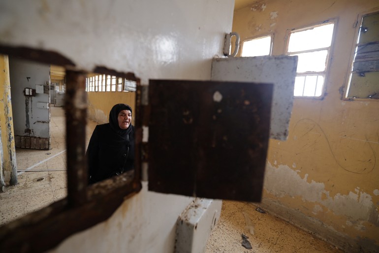 49-6-1736158971 Ibtissam Al-Nadaf who said she is still mourning two sons, one killed by a sniper during the siege of Al-Assali, the other disappeared into Sednaya prison in 2018, reacts as she hopes for any sign of her son as she tours for first time the Sednaya prison, which was known as a slaughterhouse under Syria's Bashar al-Assad rule, after fighters of the ruling Syrian body ousted Bashar al-Assad, in Sednaya, Syria December 24, 2024. REUTERS/Zohra Bensemra