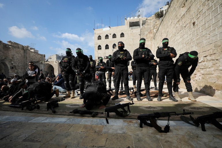 Armed men attend the funeral of Rawhi Mushtaha, a senior Hamas official and Sami Odeh, Hamas' general security service commander, who were killed in an Israeli strike during the war, amid a ceasefire between Israel and Hamas, in Gaza City January 24, 2025. REUTERS/Dawoud Abu Alkas
