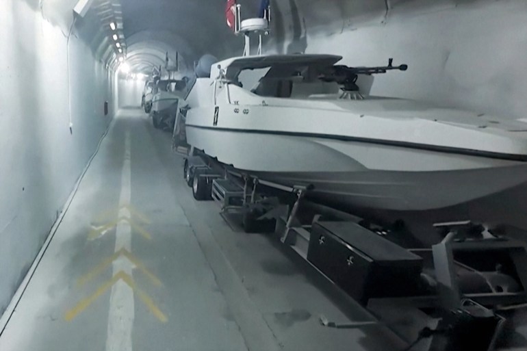 The naval arm of Iran's Revolutionary Guards unveiled an underground base housing dozens of assault boats equipped with missile launchers in footage aired by state television. IMAGES AND SOUNDBITES