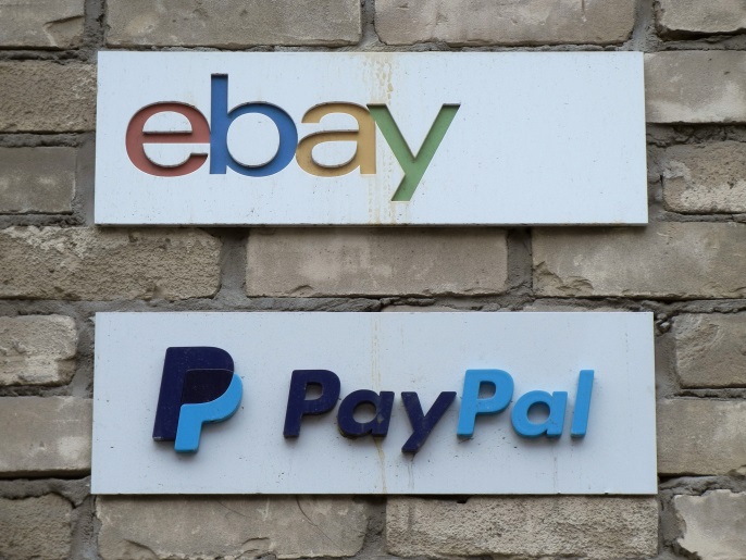 d9198977-ac42-4620-b898-3f4be69ede75 Signs are posted outside the offices of online marketplace eBay and its electronic payments division PayPal in Toronto April 5, 2015. REUTERS/Chris Helgren