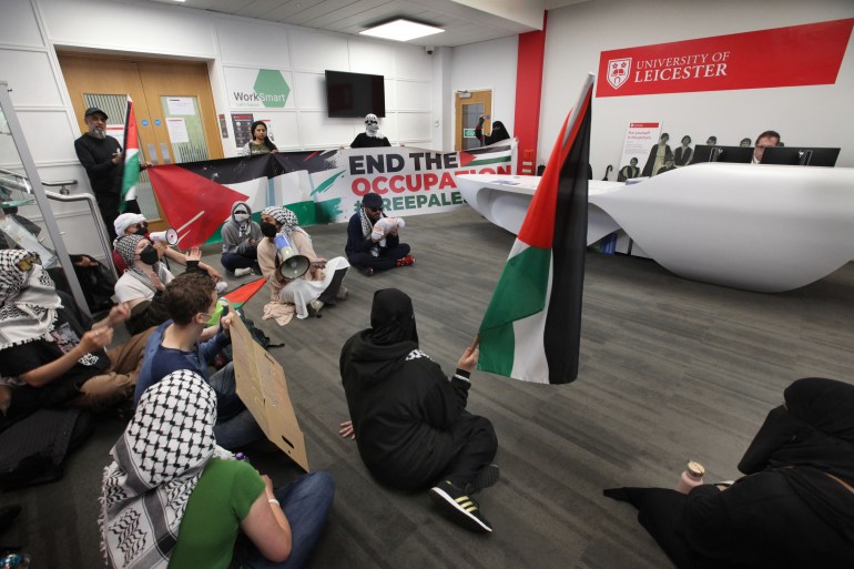 gettyimages-2155307048-1737060500 LEICESTER, ENGLAND - JUNE 3: Students and their supporters sit on the floor and take over the reception of the Fielding Johnson building on June 3, 2024 in Leicester, England. Students have occupied the reception area of the Fielding Johnson Building after learning that arms companies will be welcomed at an upcoming careers fair. They demand the university sever ties with companies profiting from the genocide in Gaza, especially arms companies, and with Barclays Bank, which heavily invests in Israeli arms company Elbit Systems. They also call for collaborative projects with Palestinian institutions. Despite setting up an encampment over three weeks ago and applying constant pressure, the students have seen little negotiation from the university. (Photo by Martin Pope/Getty Images)