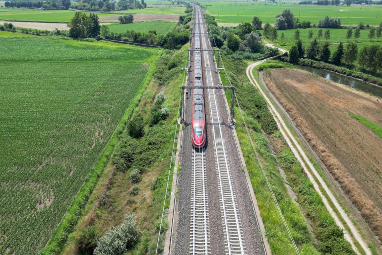 italy5-1737986261 Europe, Italy , Milan - Frecciarossa Hight speed 300km h train railway from Milan to Rome view from the drone - the faster way to travel in Italy for tourist and passengers - tourist destination ; Shutterstock ID 2494617527; purchase_order: aljazeera ; job: ; client: ; other: