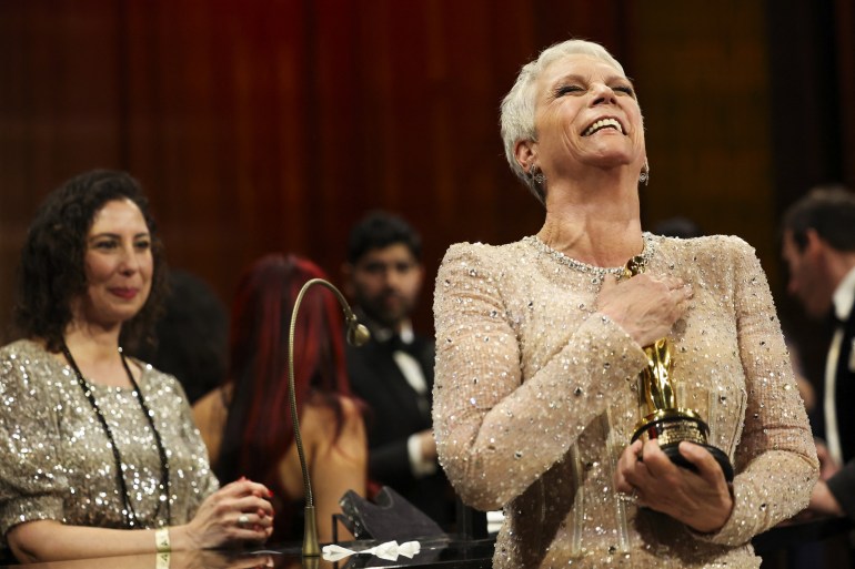 Best Supporting Actress Jamie Lee Curtis reacts while holding her Oscar at the Governors Ball following the Oscars show at the 95th Academy Awards in Hollywood, Los Angeles, California, U.S., March 12, 2023. REUTERS/Mario Anzuoni