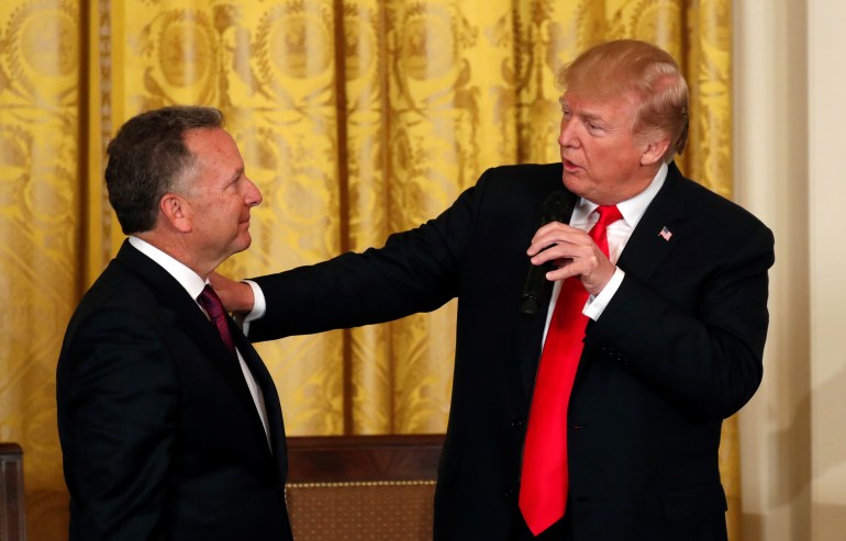 steve-witkoff-1737028997 U.S. President Donald Trump puts his hand on the shoulder of his friend Steve Witkoff, whose son Andrew died from a drug overdose, during at an opioid summit being held at the White House in Washington, U.S., March 1, 2018. REUTERS/Kevin Lamarque