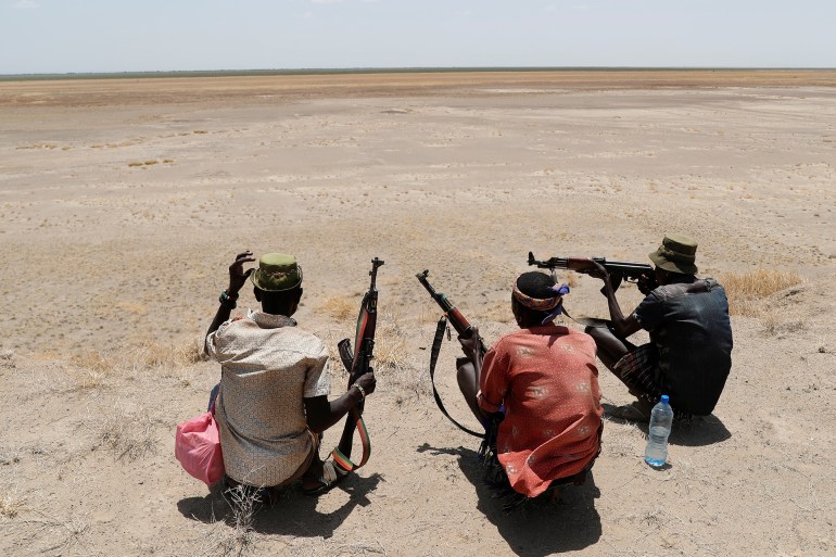 kenya-ethiopia3-1740429115 Turkana warriors patrol with guns to protect their cattle from a Dassenach warrior near Todonyang, Kenya March 21, 2019. Picture taken on March 21, 2019. REUTERS/Goran Tomasevic