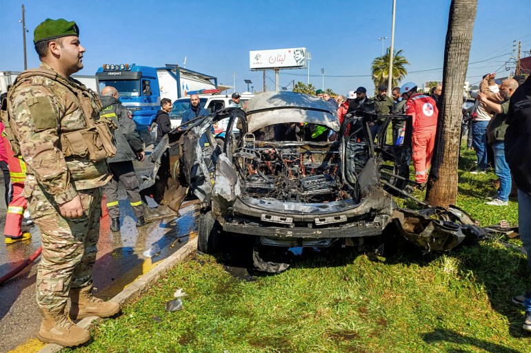 ss3-1-1739787680 Lebanese army, security forces, and civil defence first responders inspect the remains of a destroyed vehicle that was reportedly hit by an Israeli strike in Lebanon's southern city of Sidon on February 17, 2025. Lebanese official media said the strike killed one person, a day ahead of a deadline in a ceasefire between Israel and Hezbollah. "A body... was retrieved from the car that was targeted by the Israeli strike" in Sidon, "after firefighters extinguished the fire", the official National News Agency said. (Photo by AFP)
