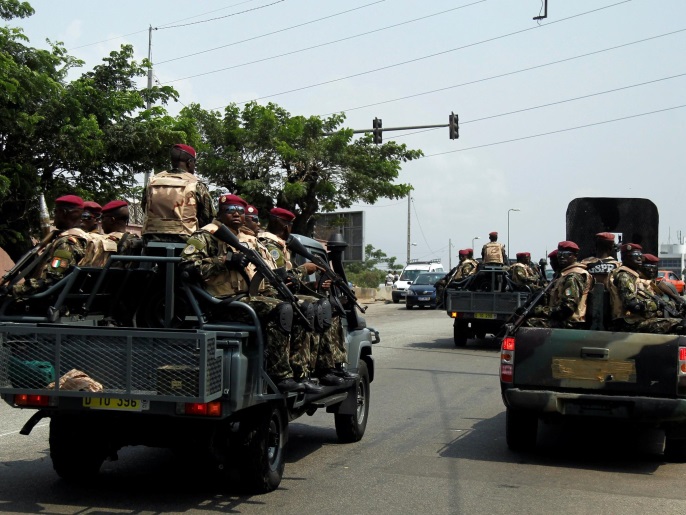 2c41f4ea-3a4f-4f5d-a565-7dac733d4c03 Soldiers of the Ivory Coast presidential guard patrol as they arrive at the port of Abidjan, Ivory Coast January 18,2017. REUTERS/Luc Gnago