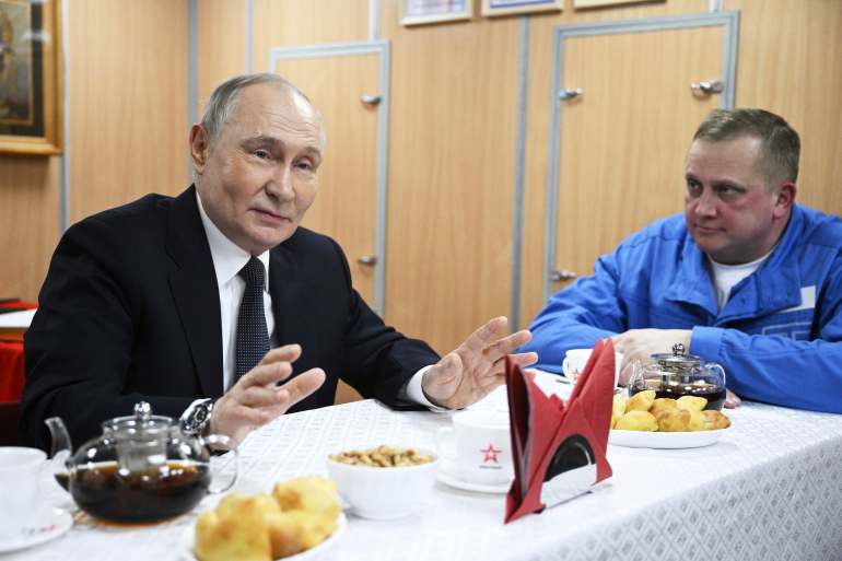ap-1651931153_b81cf9-1743123872-1 Russian President Vladimir Putin, left, speaks with crew members of the nuclear-powered submarine Arkhangelsk at the Atomflot, a service base for nuclear-powered fleet, in Murmansk, Russia, Thursday, March 27, 2025. (Kirill Zykov, Sputnik, Kremlin Pool Photo via AP)
