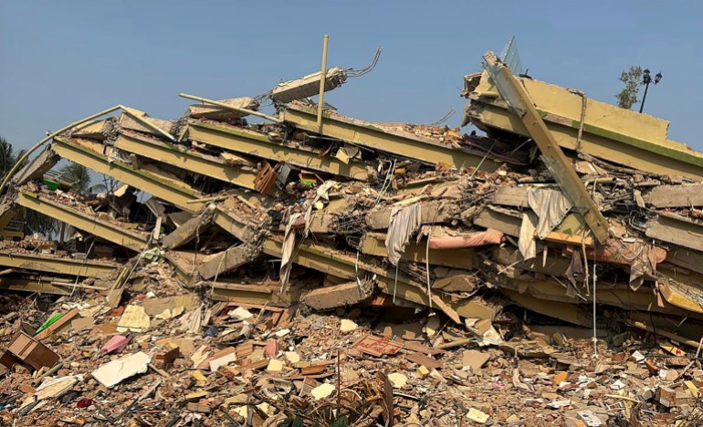 ap-861071315_baa4b1-1743349567 The ruins of Sky Villa Condo that collapsed in Friday's earthquake in Mandalay, Myanmar, Sunday, March 30, 2025. (AP Photo/Thein Zaw)