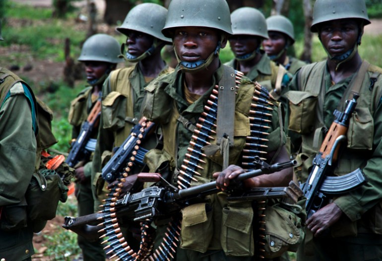 d8a8d98ad9825-2-1740391738-2 Congolese soldiers patrol the town of Rutshuru in eastern Congo, January 28, 2009. Plans to integrate Tutsi rebels into Congo's army faltered before they could begin on Wednesday, underlining the challenges facing efforts to pacify the east despite renewed Congo-Rwanda cooperation. Separately,Ugandan Lord's Resistance Army rebels killed more than 100 people in a village in Congo in an apparent reprisal for army operations against them, the United Nations said on Tuesday.REUTERS/Alissa Everett (DEMOCRATIC REPUBLIC OF CONGO)
