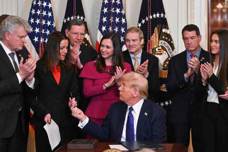 US President Donald Trump signs the Laken Riley Act