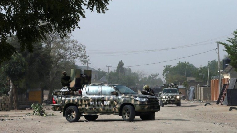 f663b965-635c-4d23-b60d-50ea40d57fc9 Nigerian military secure the area where a man was killed by suspected militants during an attack around Polo area of Maiduguri, Nigeria February 16, 2019. REUTERS/Afolabi Sotunde