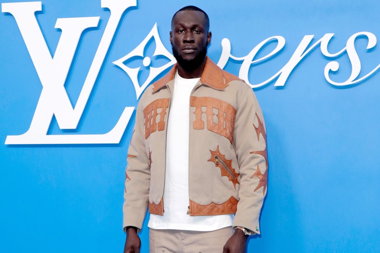 PARIS, FRANCE - JUNE 18: (EDITORIAL USE ONLY - For Non-Editorial use please seek approval from Fashion House) Stormzy attends the Louis Vuitton Menswear Spring/Summer 2025 show as part of Paris Fashion Week on June 18, 2024 in Paris, France. (Photo by Antoine Flament/Getty Images)