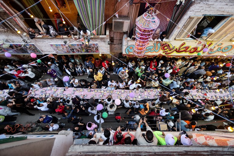 gettyimages-2204726281-1742068471 FILED - 15 March 2025, Egypt, Cairo: People attend a mass communal Iftar (fast-breaking) in El Matareya district, during the Muslim's holy fasting month of Ramadan. Residents of Ezbet Hamada in El Matareya district are striving to uphold their long-standing tradition of mass Iftar during Ramadan, as rising food prices and economic hardships in Egypt make such gatherings an increasingly vital source of relief and community support. Photo: Mohammed Talatene/dpa (Photo by Mohammed Talatene/picture alliance via Getty Images)