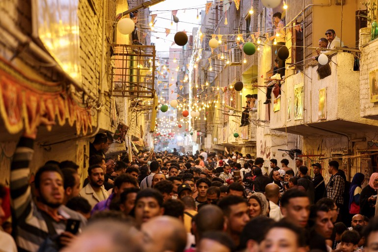 iftar-egy1-1742068369 Egyptian residents of Ezbet Hamada in Cairo's Mataria district gather to eat Iftar, the meal to end their fast at sunset, during the holy fasting month of Ramadan in Cairo, Egypt March 15, 2025. REUTERS/Mohamed Abd El Ghany