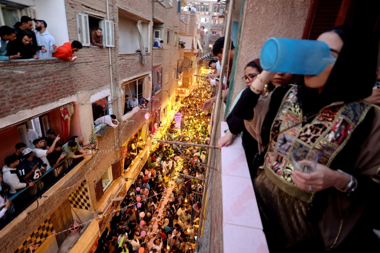 iftar-egy9-1742068384 Egyptian residents of Ezbet Hamada in Cairo's Mataria district gather to eat Iftar, the meal to end their fast at sunset, during the holy fasting month of Ramadan in Cairo, Egypt March 15, 2025. REUTERS/Mohamed Abd El Ghany