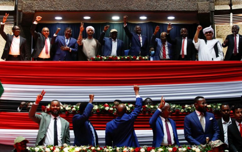 rc20xca1d5zt-1739978825 Delegates affiliated to Sudan's Rapid Support Forces (RSF) react during a meeting in Nairobi
