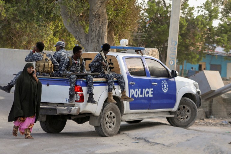 somal-reu5-1729192096 A Somali police pick-up track drives to the scene of an explosion in a restaurant often patronised by police officers, near a police training camp in Mogadishu, Somalia October 17, 2024. REUTERS/Feisal Omar TPX IMAGES OF THE DAY