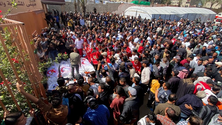 08-3-1743937817 FILE PHOTO: Palestinians mourn medics, who came under Israeli fire while on a rescue mission, after their bodies were recovered, according to the Red Crescent, at Nasser hospital in Khan Younis in the southern Gaza Strip March 31, 2025. REUTERS/Hatem Khaled/File Photo