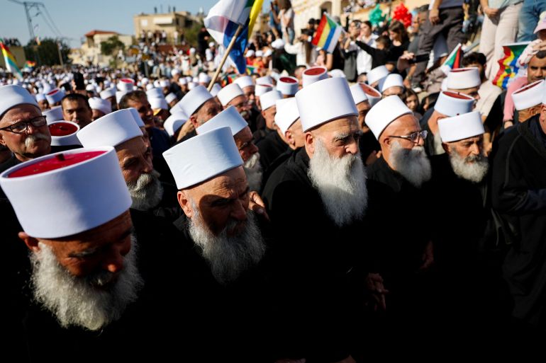 202inians-druze-1742031231-1 People gather on the day Israeli Druze leader Sheik Mowafaq Tarif and around 100 Syrian Druze religious elders, in the first Druze delegation from Syria just after 1973 war, visit the Nabi Shuayb Shrine, a holy place for the Druze community, in northern Israel March 14, 2025. REUTERS/Ammar Awad